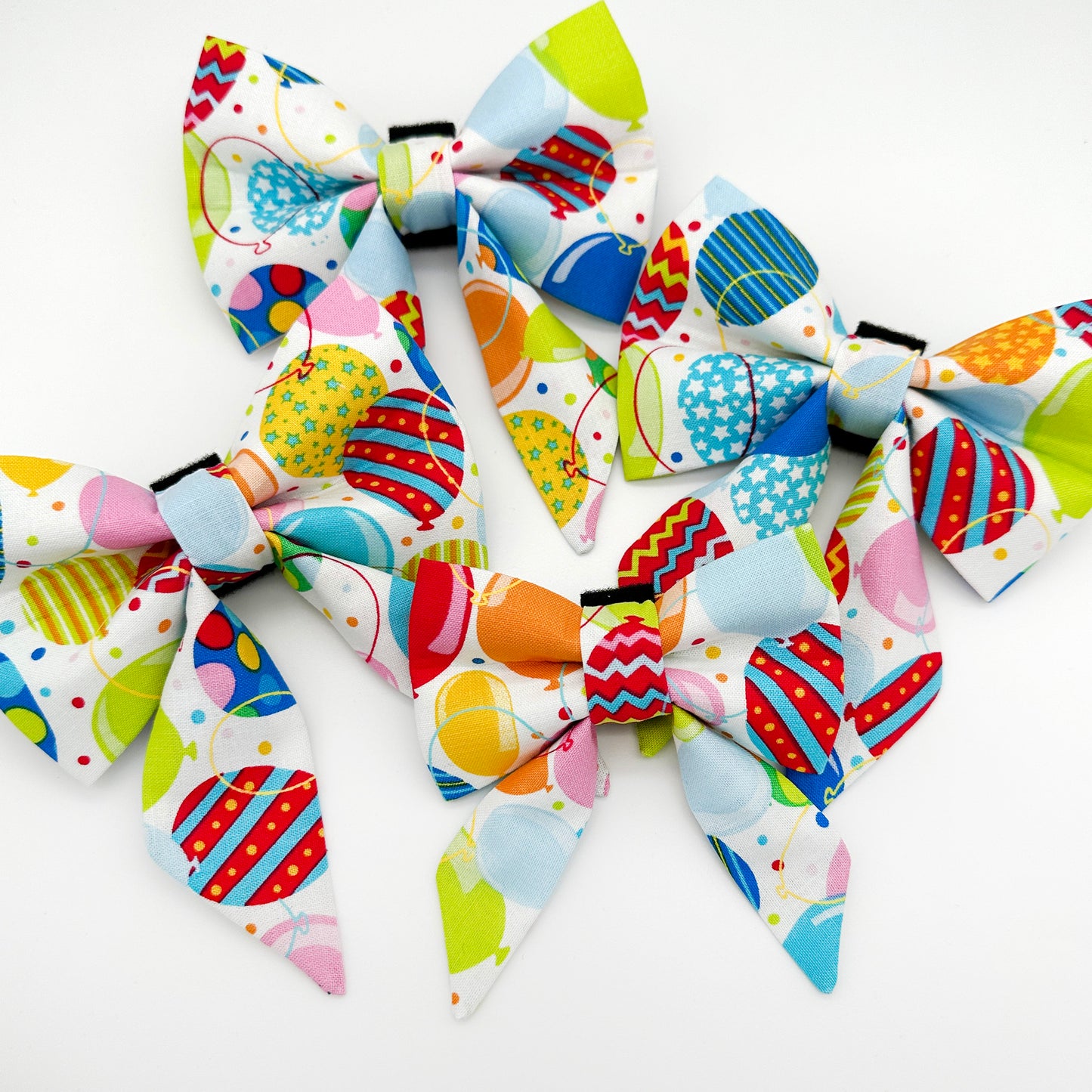 Colorful patterned bows on a white background