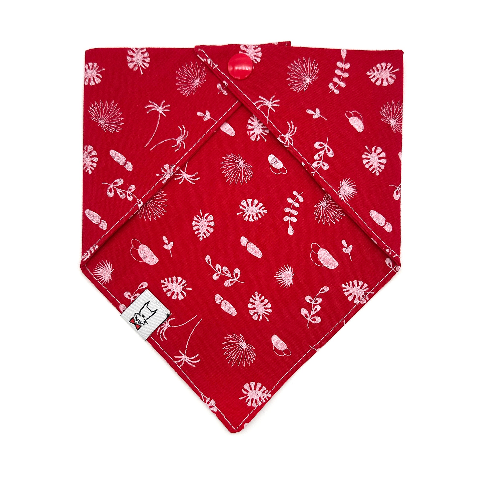 Red bandana with white floral pattern on a white background