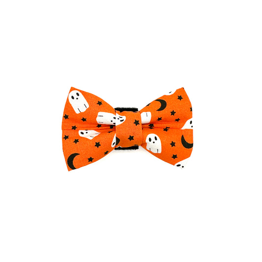Halloween-themed bow tie with ghosts and black cats on an orange background